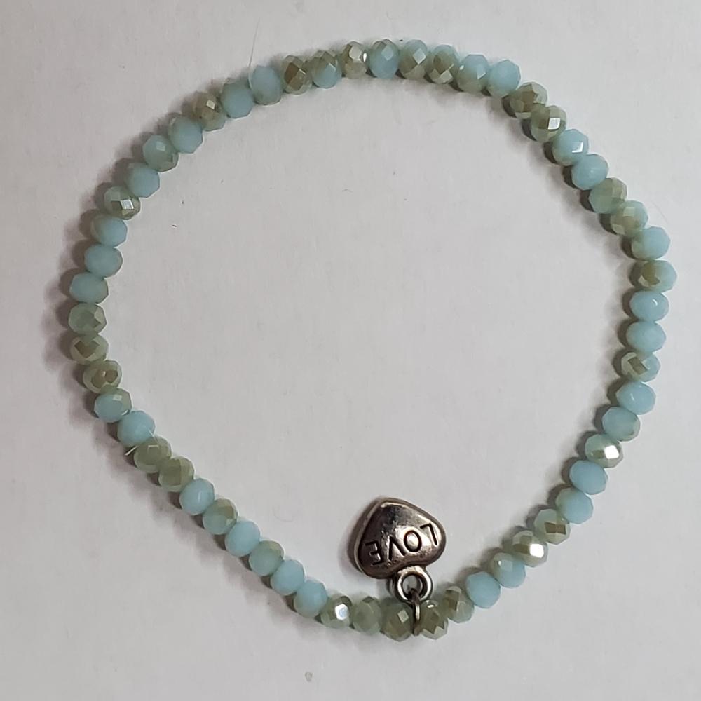 Bracelet with two colors and love charm